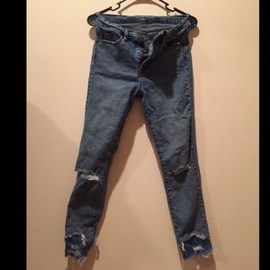 Multi hemmed ripped jeans